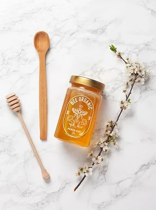 Bee Organic raw honey jar packaging and product photography